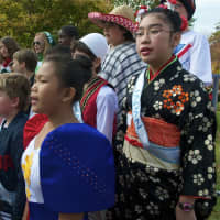 <p>Students from the Julian Curtiss School, representing 60 countries and speaking 30 languages, celebrate U.N. Day on Thursday. Here students sing with the Community Sing-along.</p>
