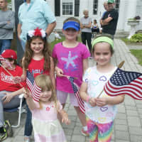 <p>Kids get ready to wave the flag at the Memorial Day Parade in Bethel on Sunday.</p>