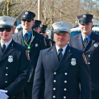 <p>Members of the Hughsonville FD march Saturday in Wappingers Falls.</p>