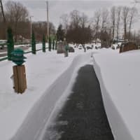 <p>Snow was deep in Hopewell Junction. This path leads from a parking lot to the Hopewell Reformed Church.</p>