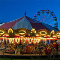<p>The merry go round at opening day at the fair.</p>