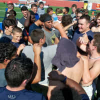 <p>Lourdes players huddle up at the end of a practice.</p>