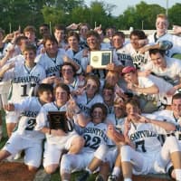 <p>The Pleasantville High boys lacrosse team holds the championship plaque.</p>