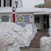 <p>Snow is piled high in front of George&#x27;s Place in Carmel.</p>