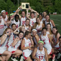 <p>North Rockland poses with the Class A championship trophy after beating Fox Lane Thursday at Mahopac High School.</p>