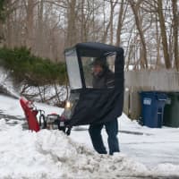 <p>This man was clearing snow in front of his house on fair Street in Carmel.</p>