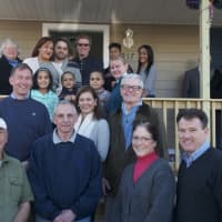 <p>The Soto family on their new steps with a group of Habitat volunteers who all worked on the new house.</p>