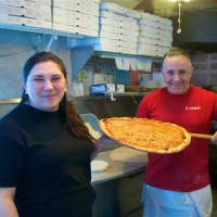 <p>Thin crust, city-style pizza is the name of the game at Carmel Brick Oven Pizza &amp; Cafe in Lake Carmel. Owner Lindita Sutaj is on left.</p>
