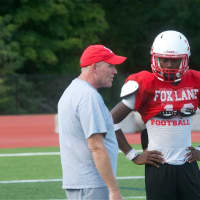<p>Fox Lane coach Bill Broggy works with his players at a recent practice.</p>