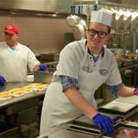 <p>Michael at his job in the kitchen at Anderson Center for Autism.</p>