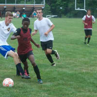 <p>The Dover High boys soccer team (in red) preps for the upcoming season at a recent scrimmage.</p>