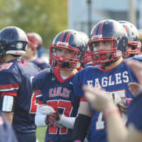 <p>Eastchester players watch the action from the sideline. </p>