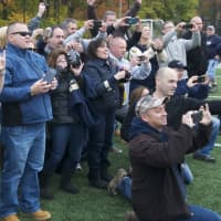 <p>Lourdes football parents snap pictures after Saturday&#x27;s win.</p>
