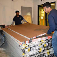 <p>Sheetrock arrives. Completion for the medical center, which is entirely privately funded, is expected in two months.</p>