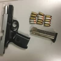 <p>Police seized a 9-millimeter Smith and Wesson handgun and ammunition from within the car during the traffic stop.</p>