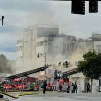 <p>Multiple crews on the scene of a 3-alarm fire at a Magoun Square restaurant building</p>