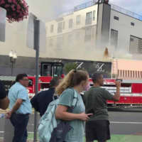 <p>Multiple crews on the scene of a 3-alarm fire at a Magoun Square restaurant building</p>