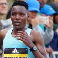 <p>Diana Kipyokei running in the 2021 Boston Marathon</p>