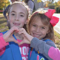 <p>A Daisy troop tied rainbow ribbons around trees throughout Wyckoff to show support for those affected by all types of cancer.</p>