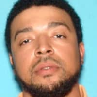 <p>Lavelle T. Davis, 33, of Galloway, N.J., one of two men facing charges in connection with a triple homicide in New Jersey, was arrested in Yonkers Saturday.</p>