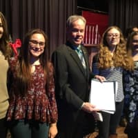<p>Rockland County Executive Ed Day displays the newly signed law banning tobacco sales at pharmacies in the county. With him are students Julia Moser, Jessica Ragonesi, Elmer Ryan and recent graduate Caitlin Capri Neier.</p>