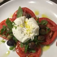 <p>Soft Italian cheese is served over olives and tomatoes as part of Del&#x27; Arte&#x27;s new &quot;small bites&quot; menu.</p>