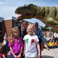 <p>Bergen County Executive James Tedesco, Parkway School students and a T-Rex pose together on Wednesday.</p>