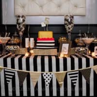 <p>A sophisticated vision in black, white and gold, this candy buffet was created by Dive in Sweets.</p>