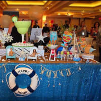 <p>A beach-themed candy buffet created by Dive in Sweets even included gummy sharks.</p>