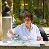 <p>Dorrie Rifkin working on one of her watercolor paintings.</p>