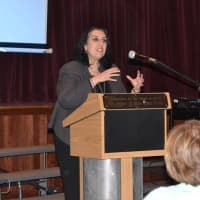 <p>Dover High School Principal Genie Angelis welcomes attendees to the Substance Abuse Forum held at Dover High.</p>