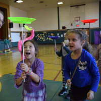 <p>Dows Lane Elementary School second-graders learned plate spinning during a visit by the Amazing Grace Circus.</p>