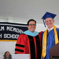 <p>Schools Superintendent Peter Giarrizzo presents Brady Tuttle with the Memorial Table at Pelham Memorial High School&#x27;s 2016 Commencement.</p>