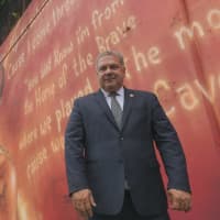 <p>Yonkers Mayor Mike Spano in front of the new DMX mural at the Calcagno Houses behind 55 School St.</p>