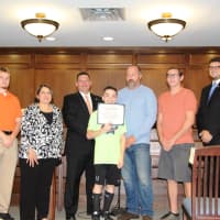 <p>Anthony Dilascio, center, is recognized for his achievements in the track program. Left to right, are coach Tom Hughes, Council person Sonya Buckman, Mayor John DeLorenzo, Robert Brady, Recreation Director, coach Jim Ryan and Councilman Pete Traina.</p>