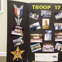 <p>A display board highlighting John Mullins&#x27; journey to Eagle Scout.</p>