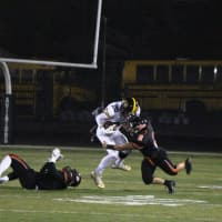 <p>Cresskill running back John Connelly is stopped by Aviator linebacker John Iurato.</p>