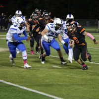 <p>Hasbrouck Heights running back John Iurato sweeps left to avoid Viking defenders on his way to the end zone in the first quarter of the game.</p>