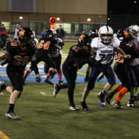 <p>Junior Aviator Anthony Dilascio runs behind his blockers on the way to his second touchdown of the game.</p>