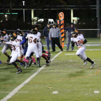 <p>Hasbrouck Heights running back Anthony Dilascio follows the blocking of Shane Ike in the Junior Aviators win over Saddle Brook Saturday night.</p>