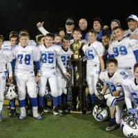 <p>North Arlington&#x27;s Junior Vikings with the championship trophy after their high-scoring game against Hasbrouck Heights.</p>