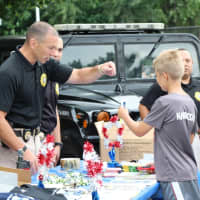 <p>Lodi police officers interact with local residents at National Night Out.</p>
