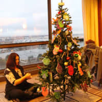 <p>The tree for New Concepts for Living features large, handmade ornaments and candy canes.</p>