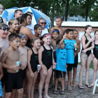 <p>New Milford Swim Team celebrates second place with the trophy.</p>