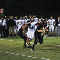 <p>Hasbrouck Heights running back Nico Facchini takes the hand off from quarterback Frank Quatrone late in the game.</p>