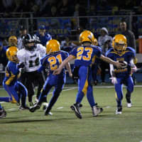 <p>Lyndhurst quarterback Tyler Collins hands off to Nathaniel Barriteau early in the Pee Wee Super Bowl against New Milford.</p>