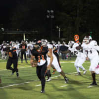 <p>Hasbrouck Heights quarterback Frank Quatrone sweeps left around the line to set up the Aviators final score of the game.</p>