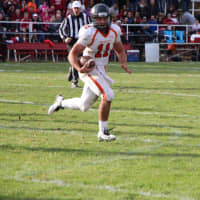 <p>Aviator quarterback Frank Quatrone looks for the end zone during a series on which Hasbrouck Heights scored the go-ahead touchdown against Pompton Lakes.</p>