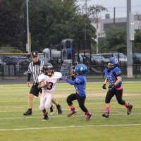 <p>Jalil Baldwin stiff arms a Wood-Ridge defender on a punt return. His gain on the play would set up Hasbrouck Heights next touchdown.</p>