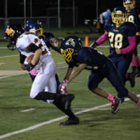 <p>Senior Aviator running back Jake Diaz avoids Falcons defenders on the way to the end zone in the third quarter.</p>